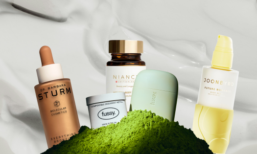 Array of beauty and wellness products on white cream background.