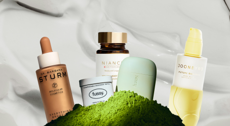 Array of beauty and wellness products on white cream background.