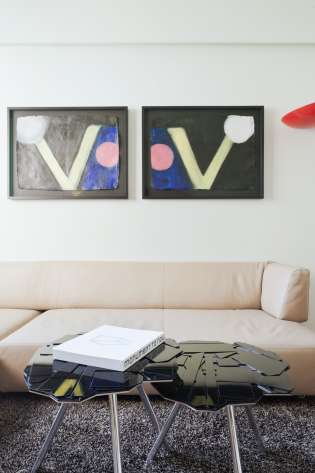 Hotel junior suite with artwork on walls .