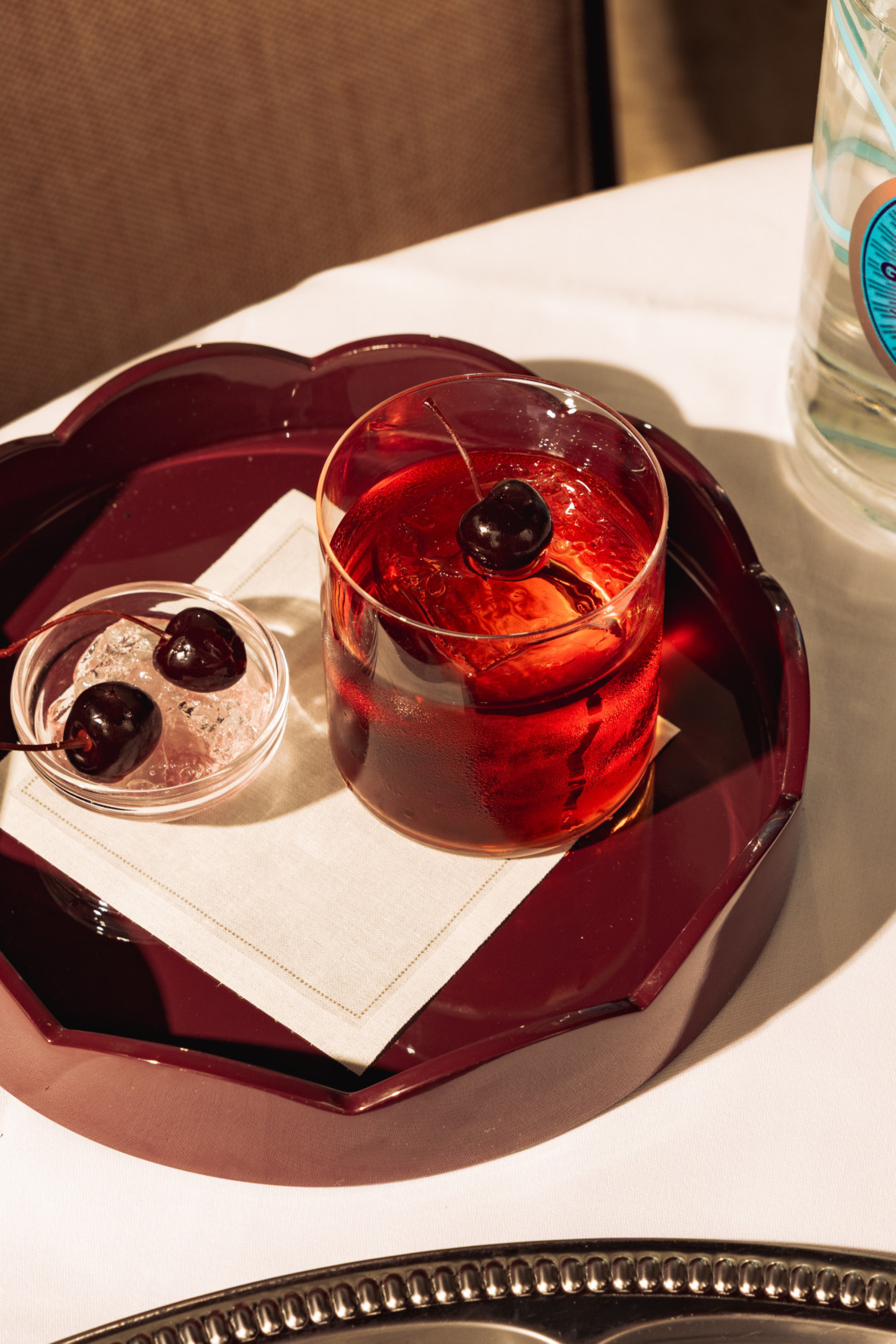 Photo of negroni topped with cherry at Nipotina
