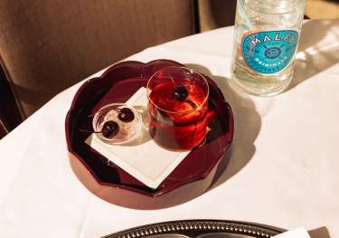 Photo of negroni topped with cherry at Nipotina.