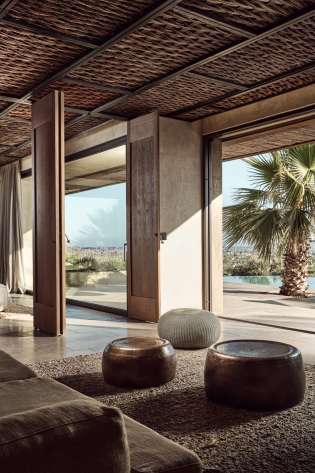 Photo of hotel lobby with sliding doors to outside area .