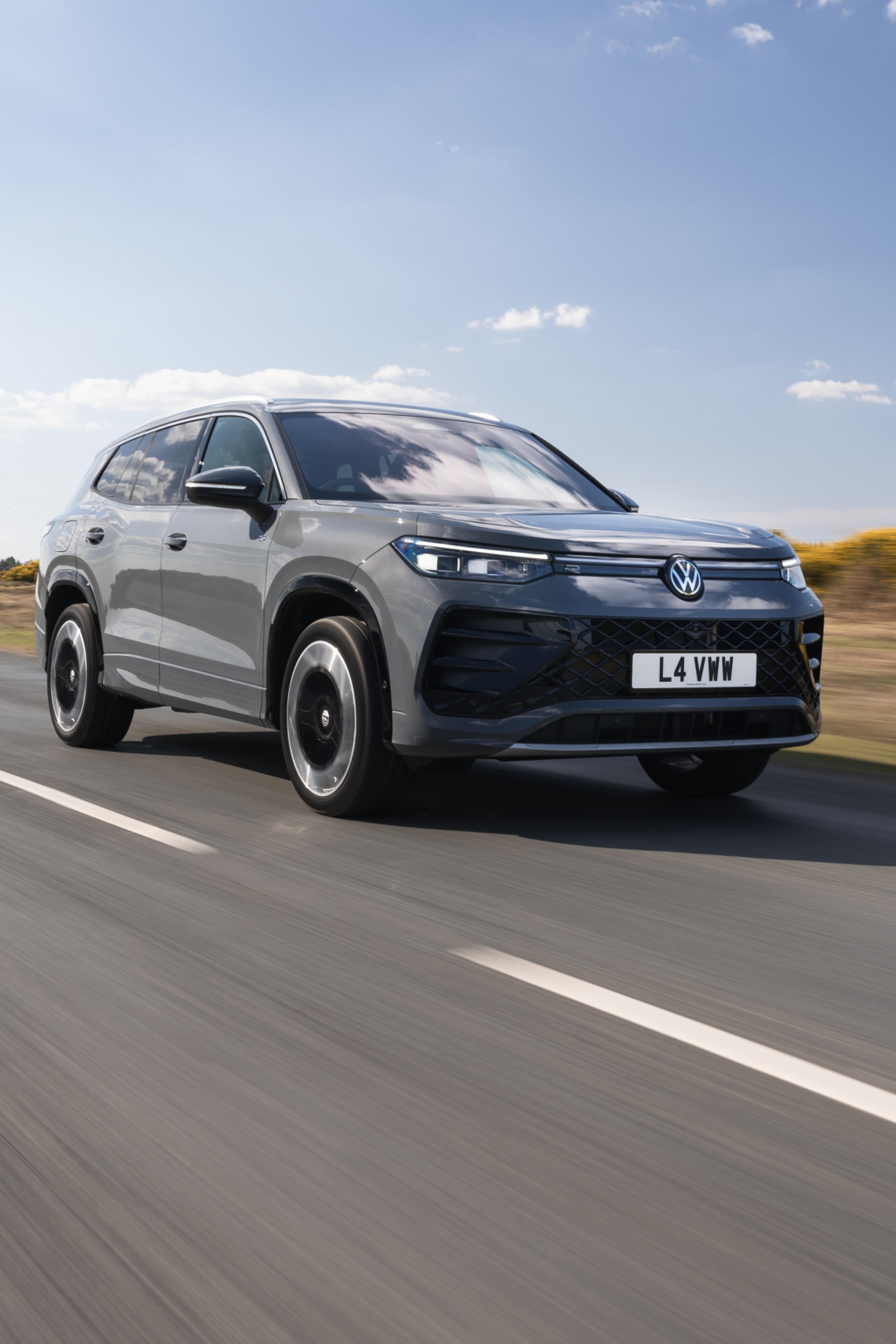 car driving along empty road