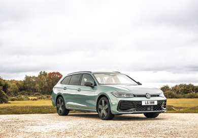 Vw passat ehybrid car parked on road.