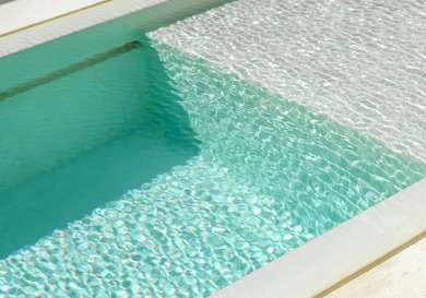 Outdoor swimming pool in the sunshine.