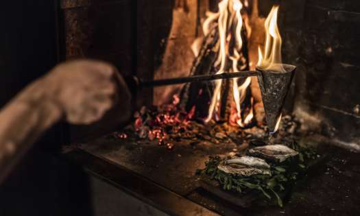 Oyster cooked flambadou preparation (c) pa jorgenssen.