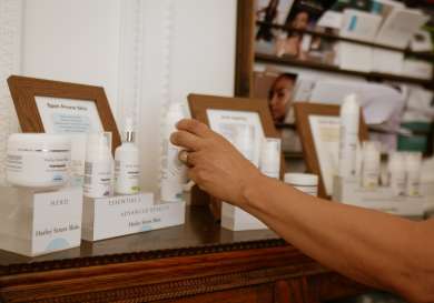 Person in skin clinic looking at skin products.