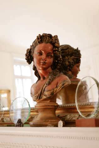 Sculpture on mantlepiece.