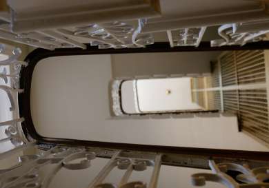 Shot looking through stair bannisters.