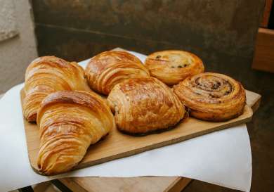 Photo of pastries on wooden board.
