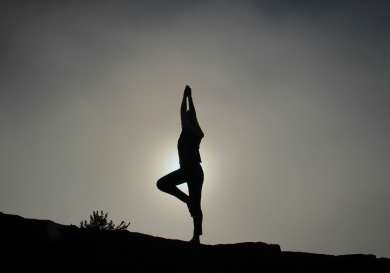 Person doing tree yoga pose.