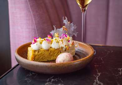 Dessert topped with rose petals.