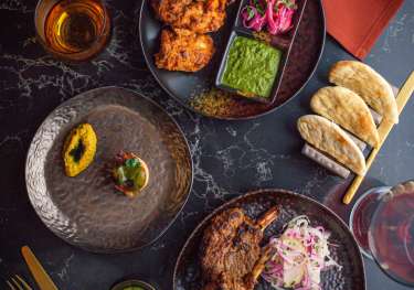 Above image of three different dishes at The Pem.
