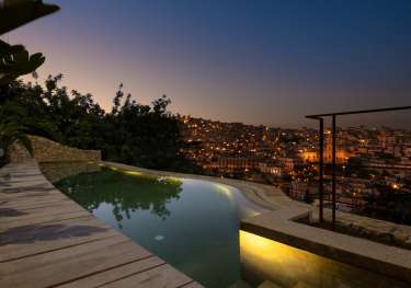Hotel swimming pool in evening.