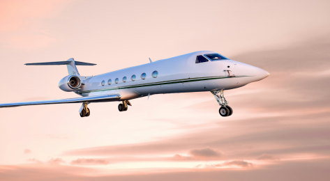 Private jet on pink cloud background.