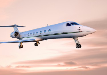 Private jet on pink cloud background.