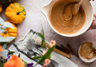 Aerial view of person making pumpkin pie .