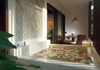 Outdoor spa bath at hotel bedroom .