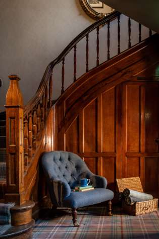 Wooden staircase inside hotel.