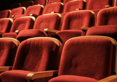 Red seating in theatre.