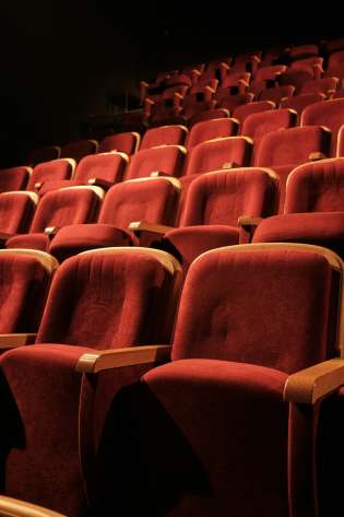 Red seating in theatre.