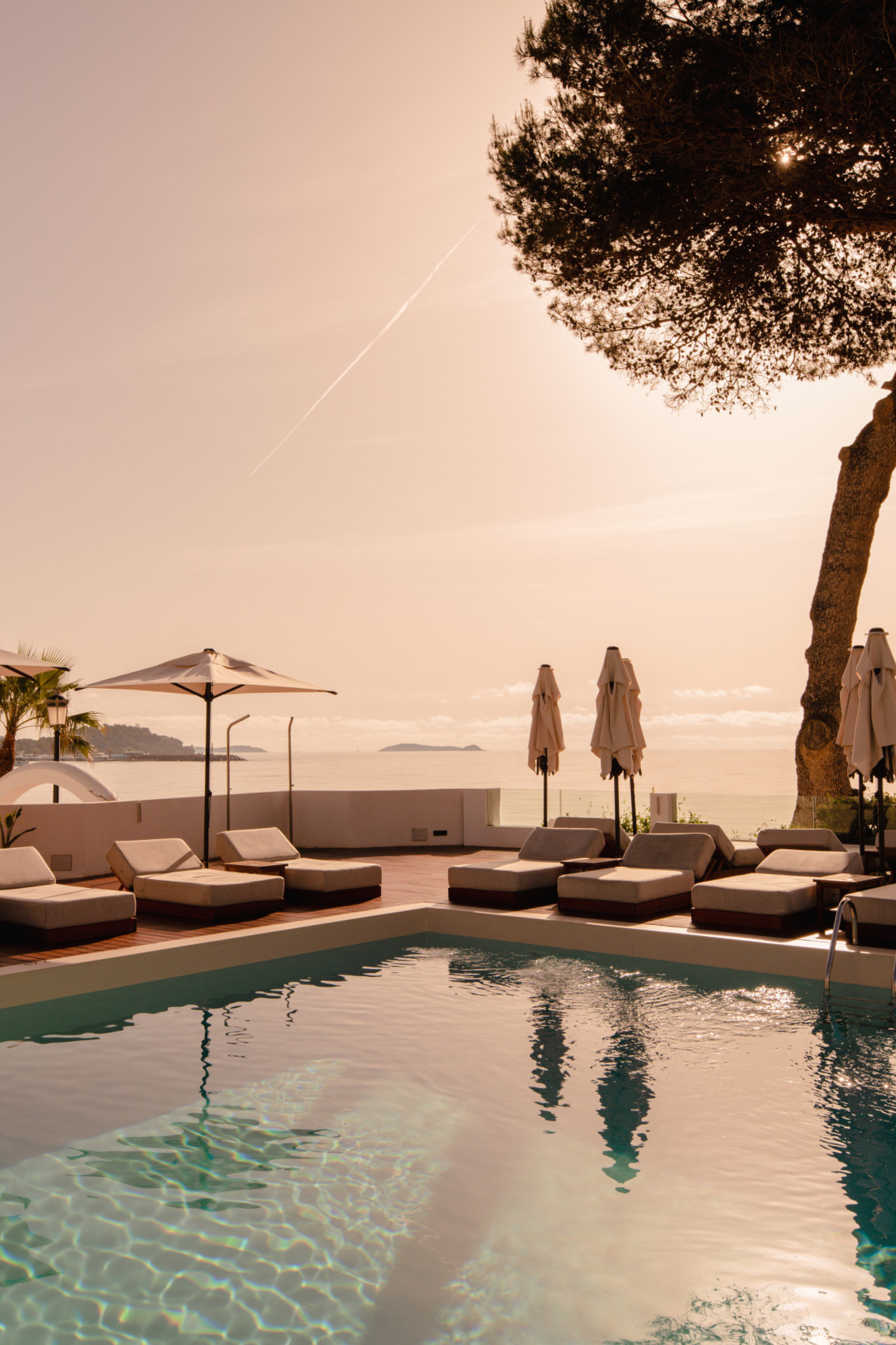 hotel riomar ibiza swimming pool with lounge beds and parasols 