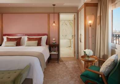 Suite inside venice hotel with pink walls .