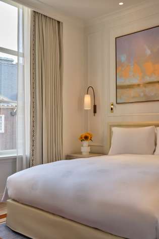 Photo of bedroom inside amsterdam hotel.