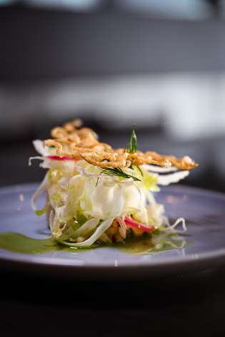 Scallop dish with green oil .