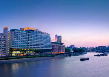 Exterior view of sea containers at sunset .