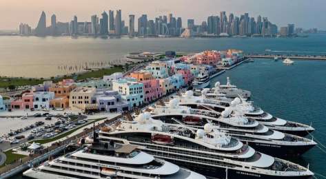 Sitemgr_old doha port in qatar with superyachts and skyline.