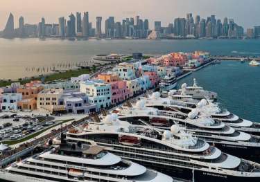 Sitemgr_old doha port in qatar with superyachts and skyline.