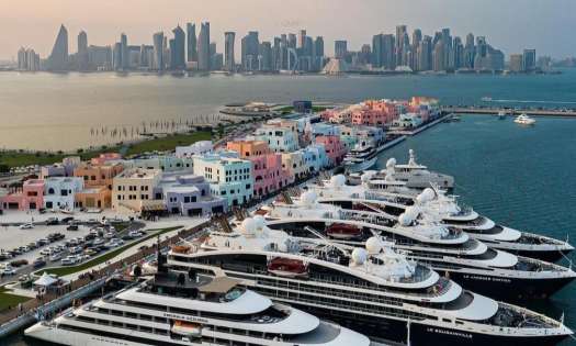 Sitemgr_old doha port in qatar with superyachts and skyline.