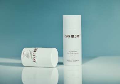 Skn to skn cleanser with blue background.