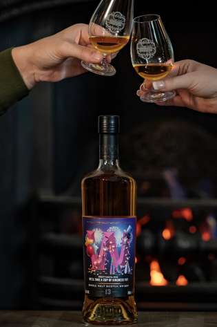 Bottle of whisky and two people clinking glasses.