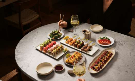 Sushi dishes at sticks'n'sushi restaurant .