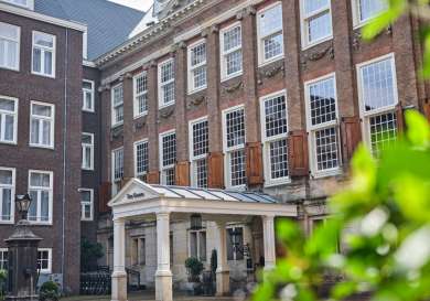 Exterior view of hotel in amsterdam with porch.
