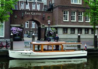 Boat outside hotel in amsterdam.