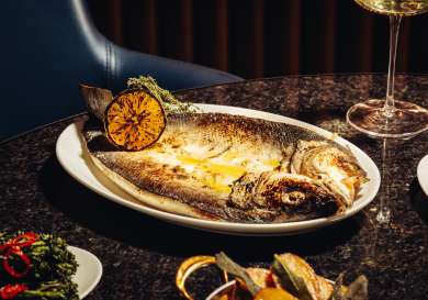 Photo of fish dish inside restaurant .