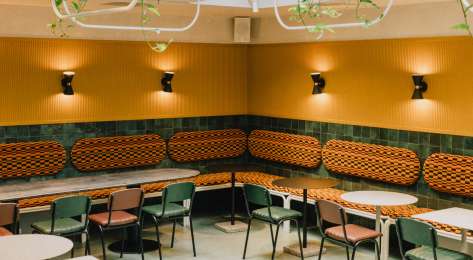 Restaurant with green and orange interior .