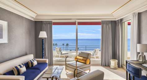Photo of hotel living room with sea view.