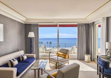 Photo of hotel living room with sea view.