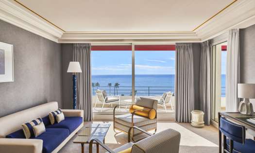 Photo of hotel living room with sea view.