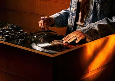 Person spinning record at listening bar in shoreditch.