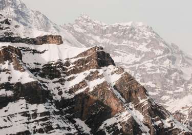 View of swiss mountains covered in snow .