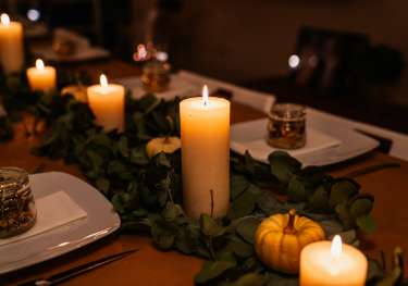 Thanksgiving table spread with candles.