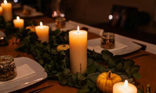 Thanksgiving table spread with candles.