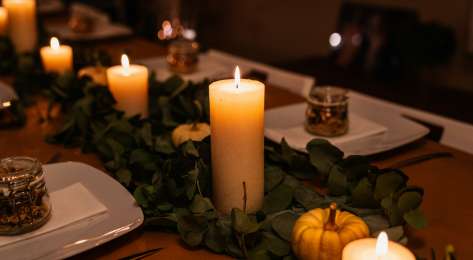 Thanksgiving table spread with candles.