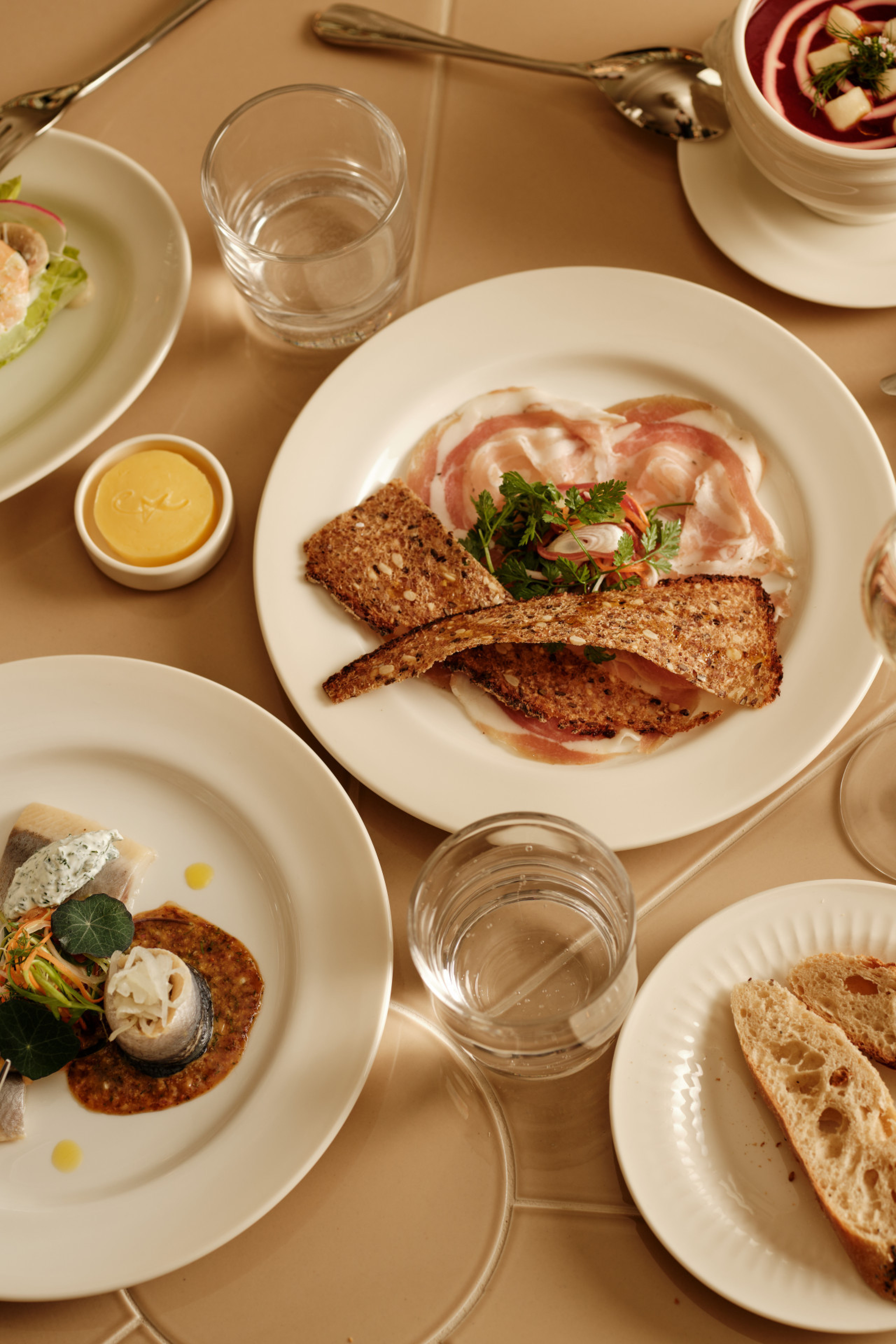 lunch spread in restaurant with glasses of wine