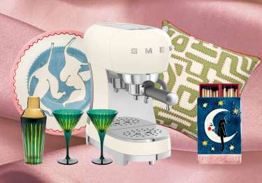 Array of gifts for the home on blush pink fabric background.